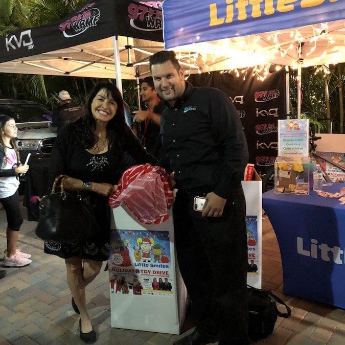 Van Kirk & Sons Pools & Spas Donates Unwrapped Toys for Little Smiles Charity Organization at the Vanilla Ice Winterfest Holiday Block Party in Wellington, Florida.