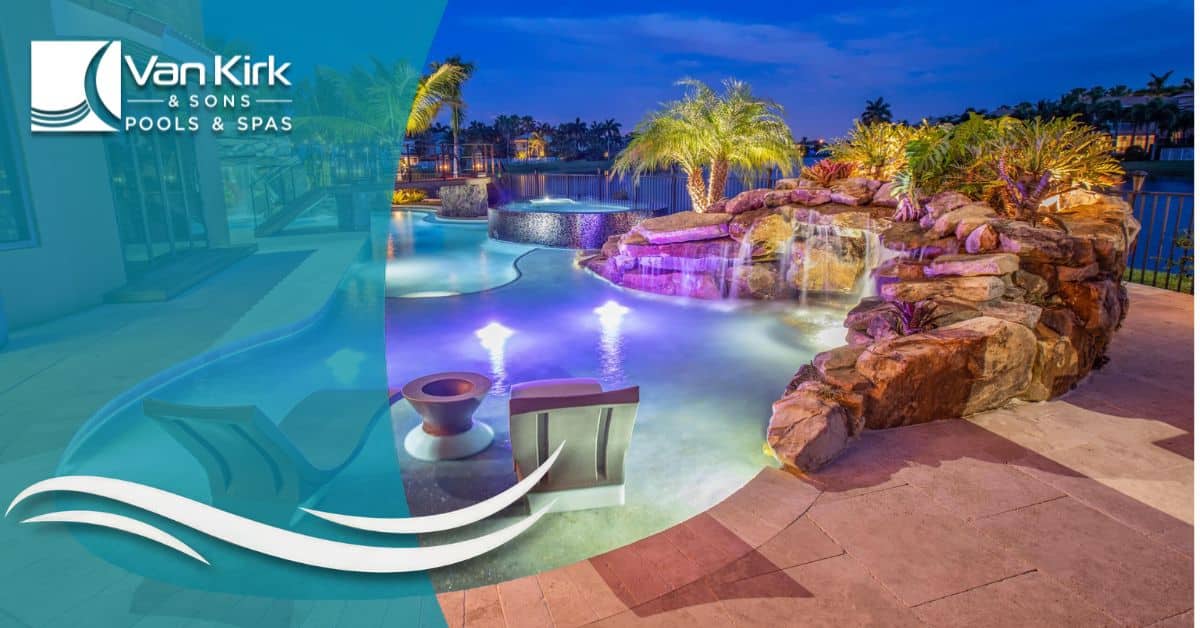Lagoon pool with rock waterfall, fire bowls, and LED lighting for a tropical backyard design