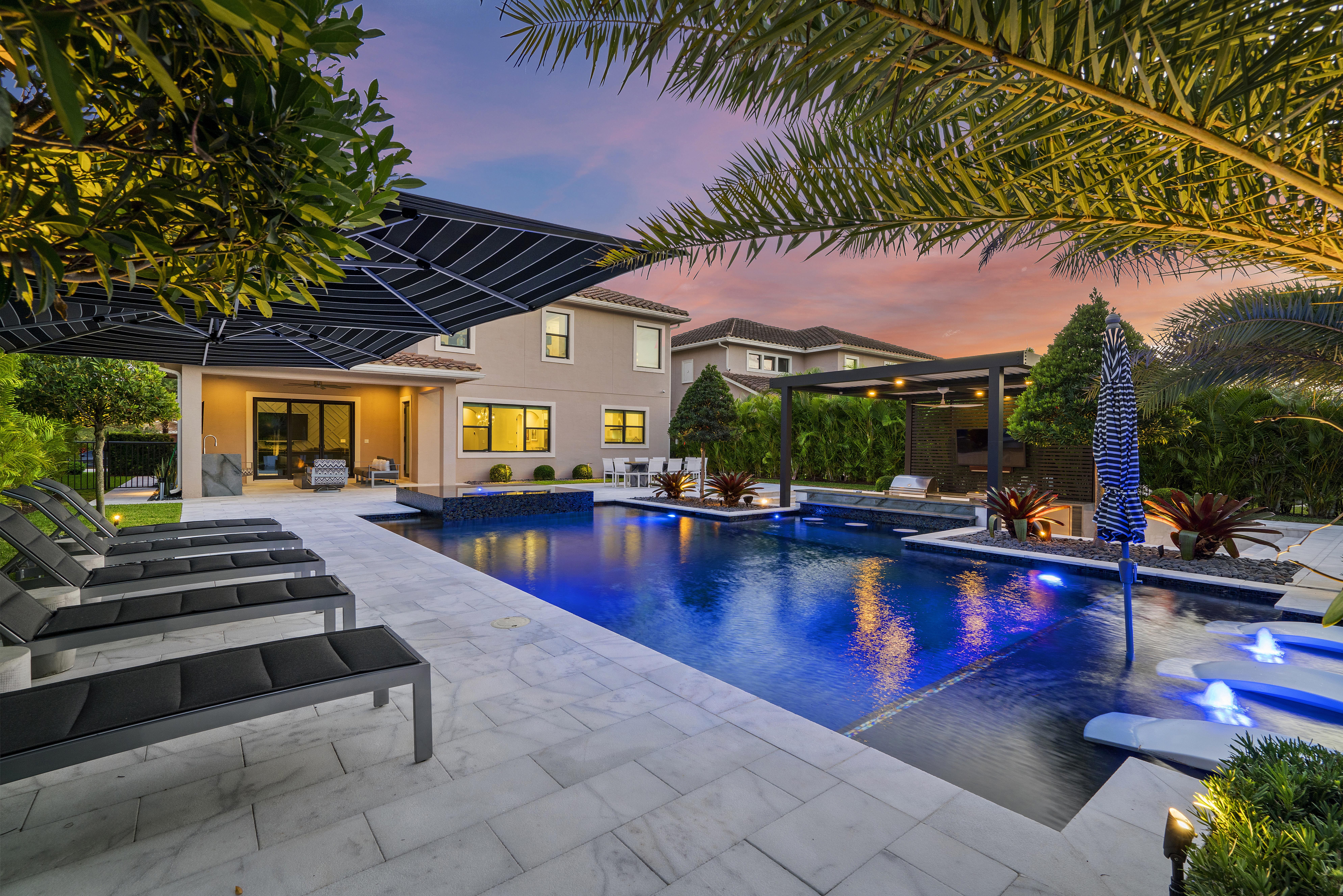 luxury pool with outdoor living area