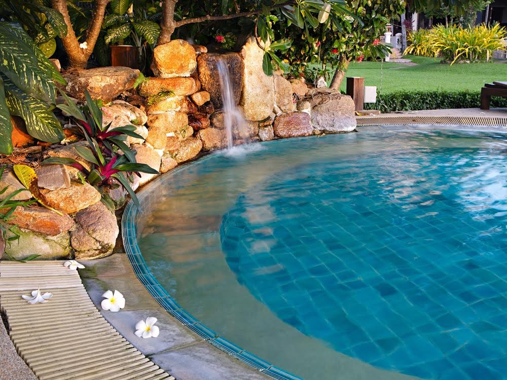waterfall - Van Kirk & Sons Pools & Spas A residential pool with swimming pool accessories, like a waterfall.