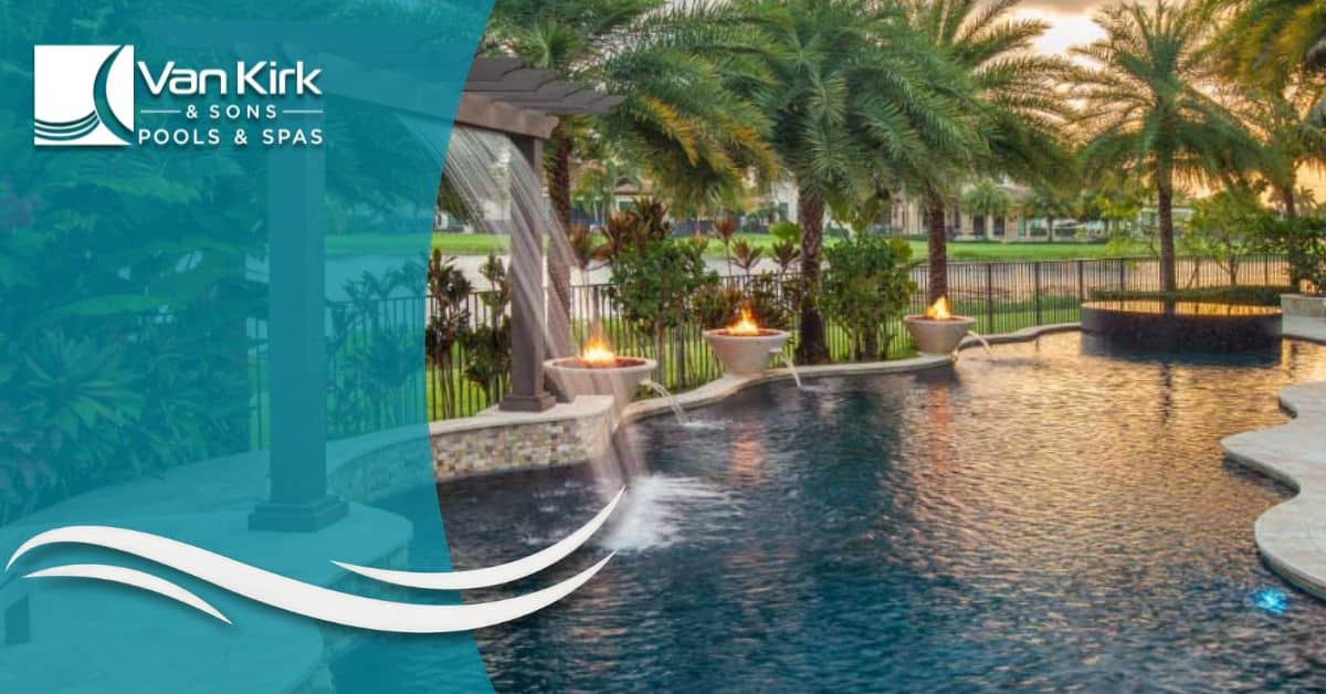 Luxury swimming pool with pergola waterfall and fire bowls designed by Van Kirk Pools