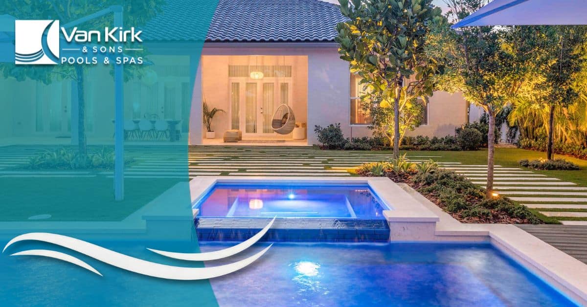 Custom spillover spa with waterfall feature flowing into luxury swimming pool by Van Kirk Pools