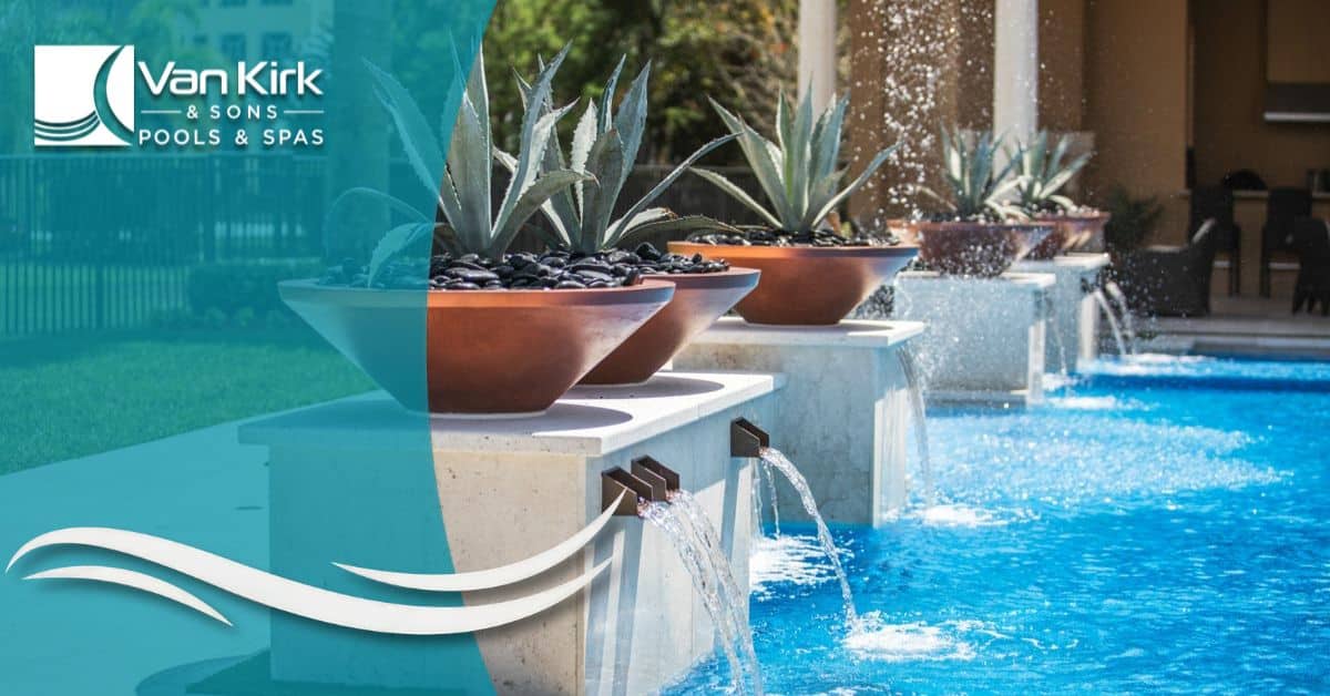 Modern Florida swimming pool with custom water scuppers designed by Van Kirk Pools