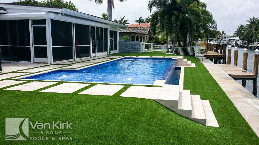 A Florida swimming pool with a retaining wall - Van Kirk & Sons Pools & Spas A Florida swimming pool with a retaining wall