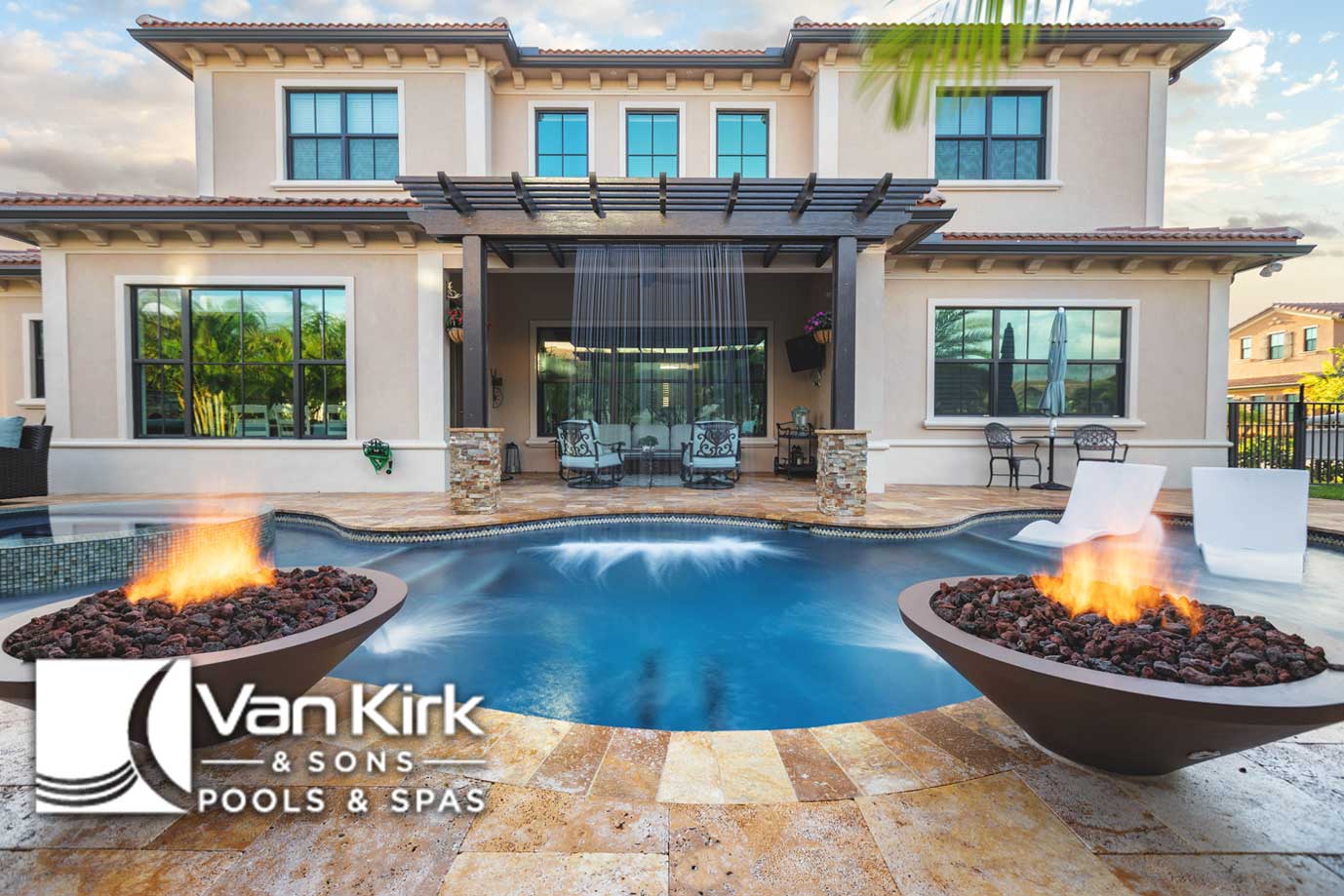 Luxurious Boca Raton, FL backyard with a pool, spa, and fire features at a modern house by Van Kirk & Sons Pools & Spas.