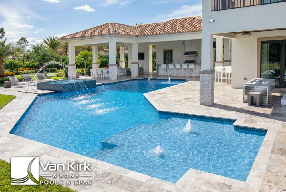 Luxury Boca Raton, Florida backyard pool design with fountains and patio area by Van Kirk & Sons Pools & Spas.
