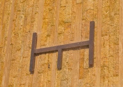 Van Kirk Pools installed The Harbour's logo on the custom stone water feature for the luxury condominium in North Miami Beach.