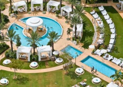 An aerial view shows the iconic bowtie-shaped pool and luxury cabanas Van Kirk Pools' commercial division built for the Fontainebleau.