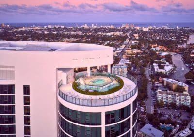 The architectural rooftop spa built by Van Kirk Pools at Icon Las Olas offers residents panoramic intracoastal and ocean views at sunset.