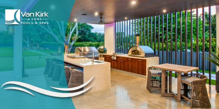 A luxury covered outdoor kitchen in Miami with a large island, stainless steel grill, and a wood-fired pizza oven.