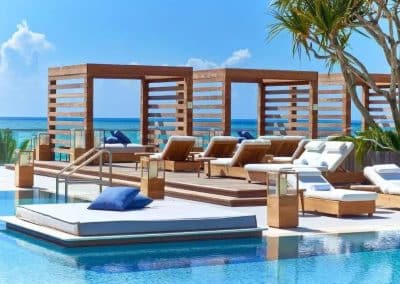Van Kirk Pools built the exclusive rooftop pool at 1 Hotel South Beach, featuring in-water daybeds and private wooden cabanas for guests.