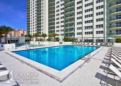 The expansive commercial lap pool and sundeck, built by Van Kirk Pools, serves as a primary amenity for Southpoint Condominiums.