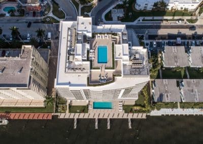 Aerial view of Adagio condominium complex featuring both rooftop and ground-level Intracoastal pools, built by Van Kirk & Sons Pools & Spas.