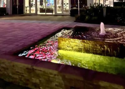 Illuminated custom fountain with LED lighting at City Furniture Boca Raton by Van Kirk Pools.