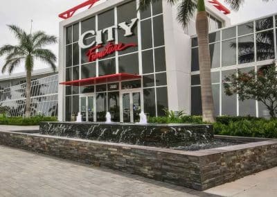 Custom fountain installation at City Furniture Boca Raton by Van Kirk Pools.