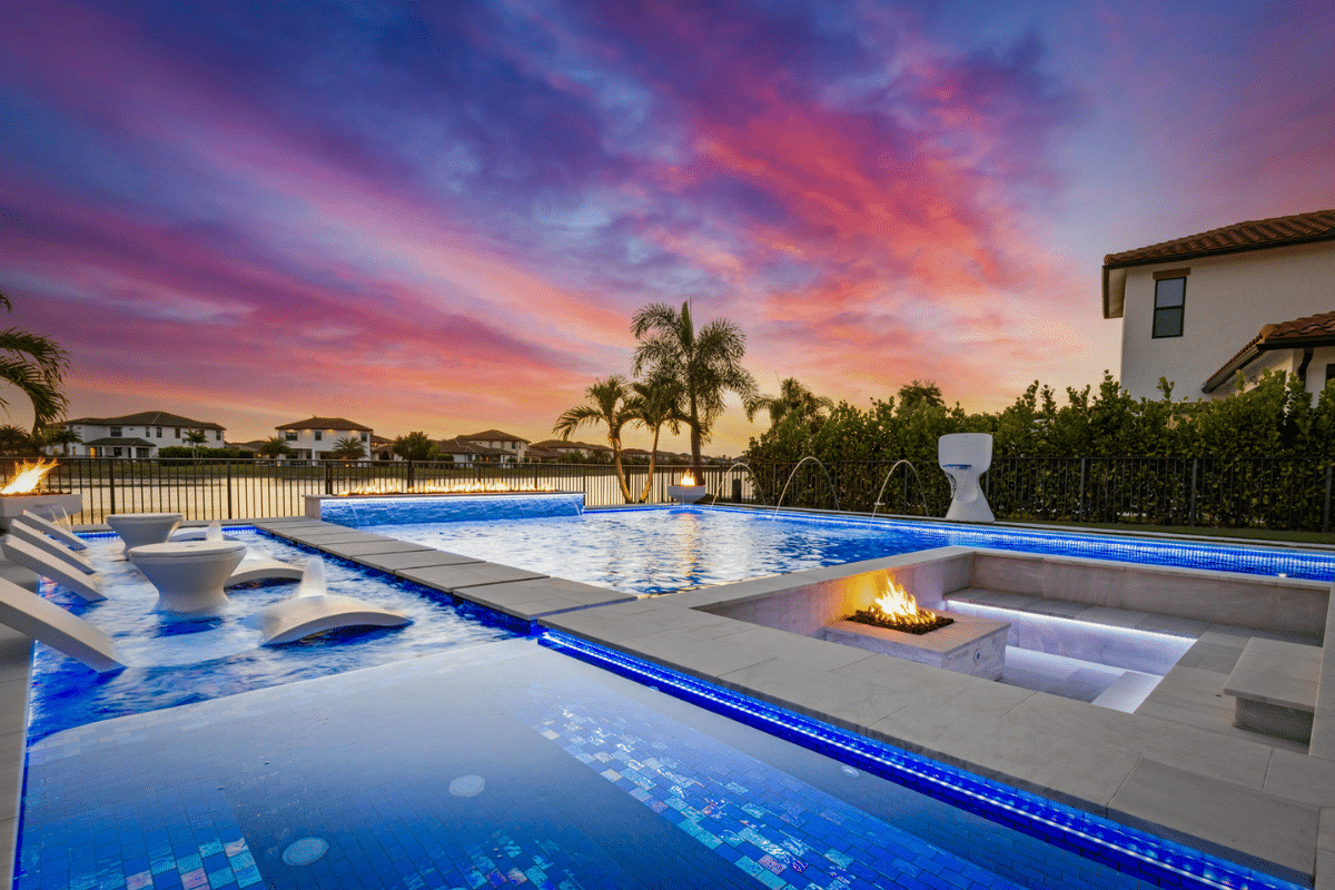 Custom inground pool with sunken fire pit and modern tile design