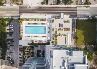 Overhead aerial view of a large residential amenity pool and deck at a high-rise in Downtown Fort Lauderdale, by Van Kirk & Sons Pools & Spas.
