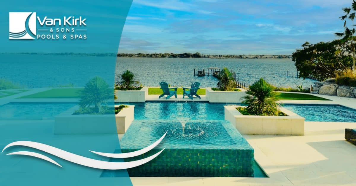 Luxury swimming pool with a central fountain feature overlooking a waterfront view