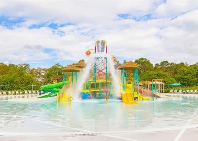 The commercial water park at Lion Country Safari, built by Van Kirk Pools, featuring a zebra-themed 550-gallon dump bucket, slides, and a zero-entry pool.