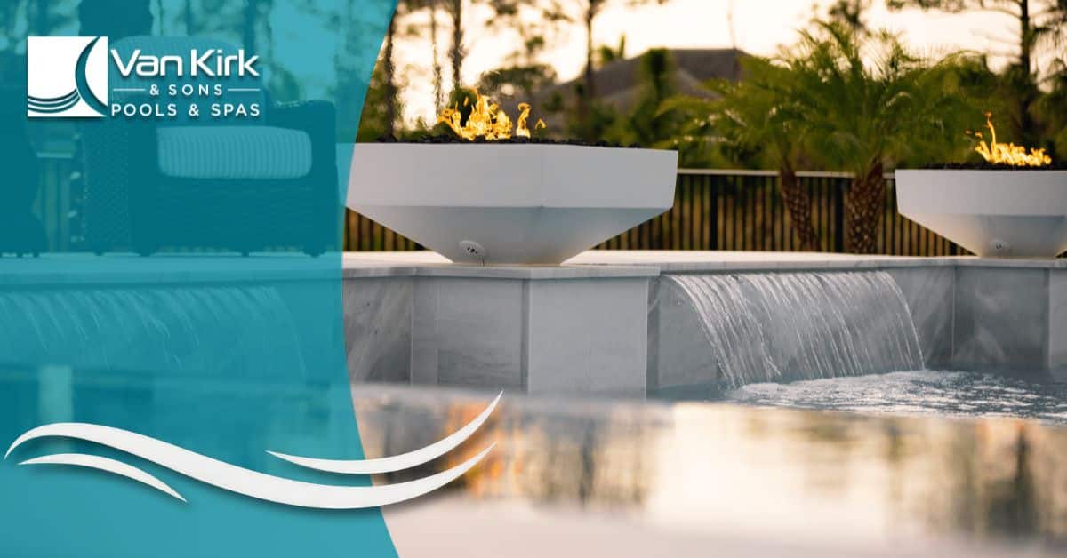 Luxury swimming pool with fire features and LED lighting, representing cost factors in pool design.